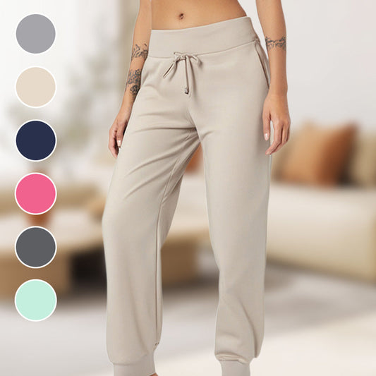 Joggingbyxor med hög midja och smal passform, dragsko och fickor