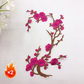 Elegant strykmärke med plommonblomstmotiv