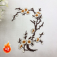 Elegant strykmärke med plommonblomstmotiv