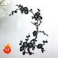 Elegant strykmärke med plommonblomstmotiv